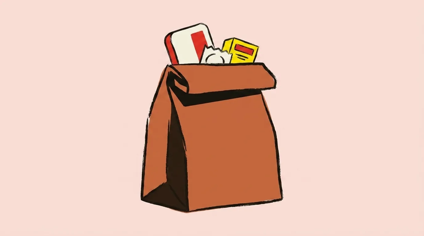 A paper supply bag with a naloxone case and a foil packet showing over the fold