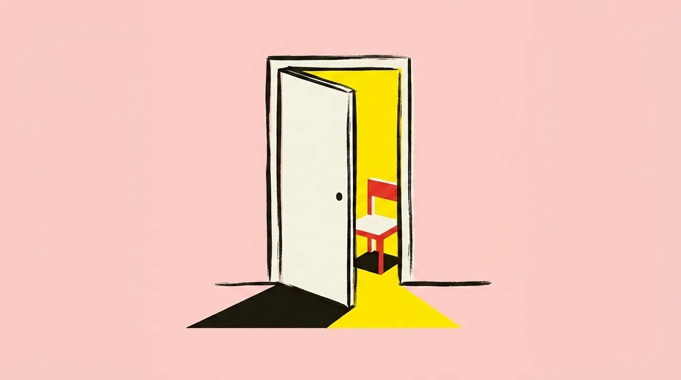A door standing ajar with warm light coming through