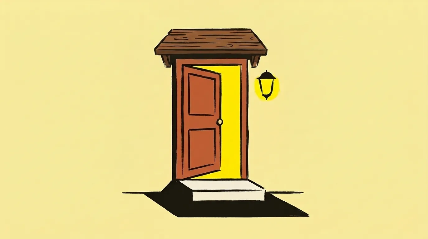 An exterior doorway under a small canopy, with a lamp lit warm above it and a step up to the threshold